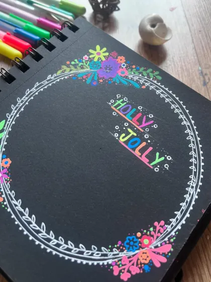 A close-up of the "Holly Jolly" Christmas wreath doodle.