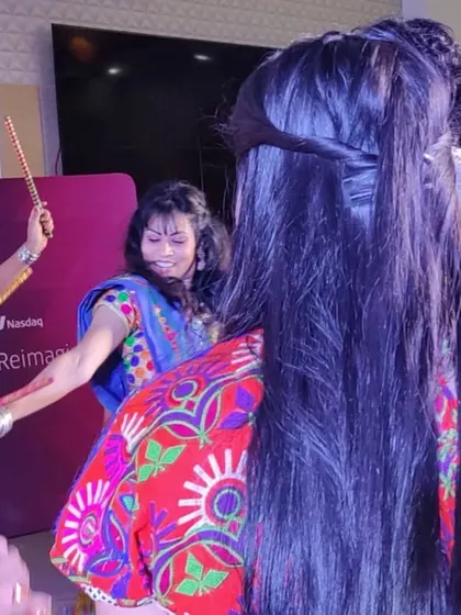 A candid shot from a Navratri event, showing the fun and interactive nature of the dance.
