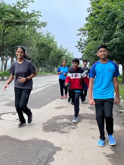 Our students jogging together near Hulimavu lake. Cardiovascular exercise is key for building the stamina required for long shooting competitions.