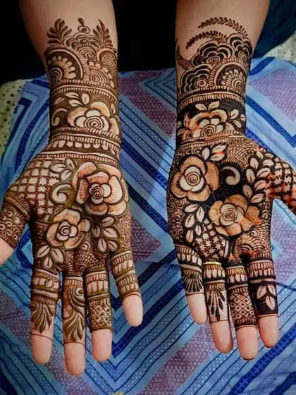 A beautiful floral design with a mix of roses and other traditional patterns. The contrast between bold flowers and fine-line fillers is lovely.