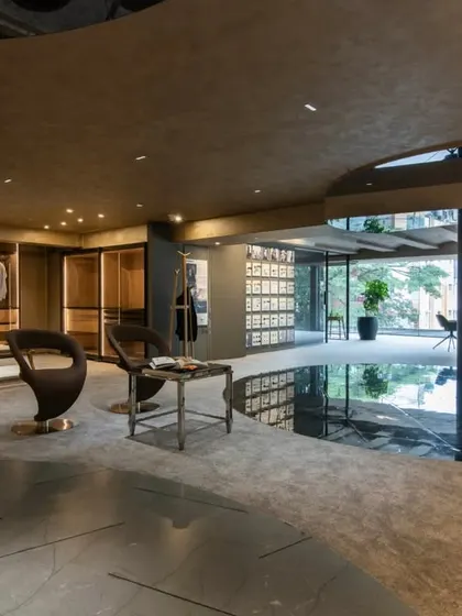 Additional views of the Gala showroom, showcasing the luxurious walk-in closet displays, the reflective marble floor, and the seamless integration of product showcases into the architectural design.
