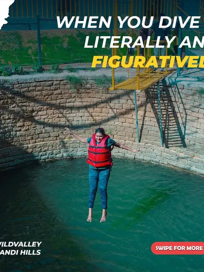 A guest takes a joyful leap into the water at our Nandi Hills resort. It's all about diving in and having fun, both literally and figuratively.