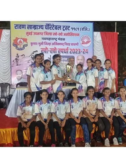 Our girls' team with the winners' trophy at the Mumbai Suburban District Championship.