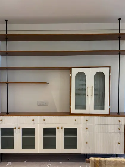 Because every house needs a dramatic shelf for books you won’t read. A modern, tension-rod shelving unit that's both a statement piece and functional storage.