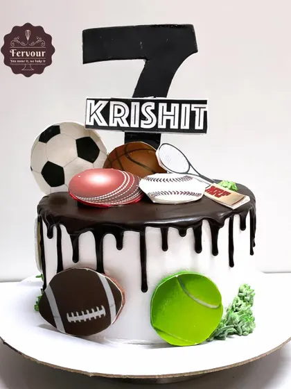 A sports-themed cake for a 7th birthday, featuring various sports balls like a football, basketball, and cricket ball. It's a perfect cake for a young athlete.