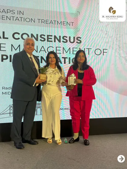 Receiving a token of appreciation at the Eucerin event. It is an honor to contribute to discussions that shape the future of dermatological treatments for conditions like hyperpigmentation.
