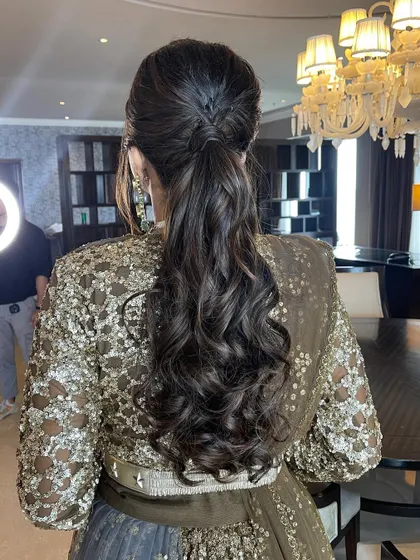 Another angle of the braided messy ponytail, showing its texture and volume.