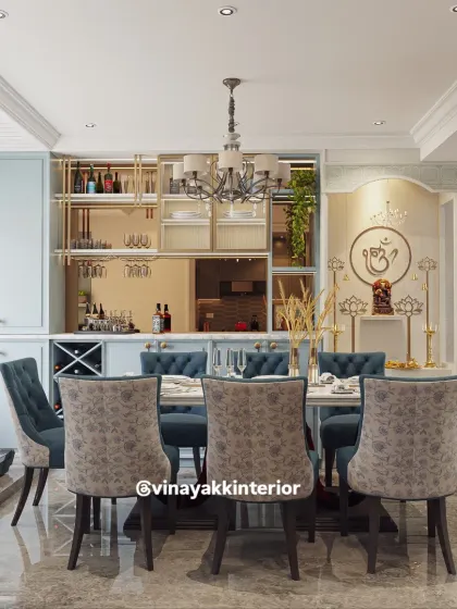 In many homes, the dining area is a multi-functional space. Here, I integrated a sophisticated bar counter and a serene pooja unit into the dining room design. This creates a harmonious environment that serves different needs, blending social gatherings with spiritual tranquility.