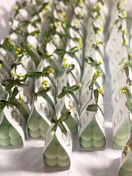 Another style of our baby bubble candle wedding favors, this time with a dark green ribbon and a gold monogram tag.