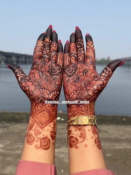 A beautiful dark stain on a floral design, photographed outdoors to show the true richness of the color against the skin.