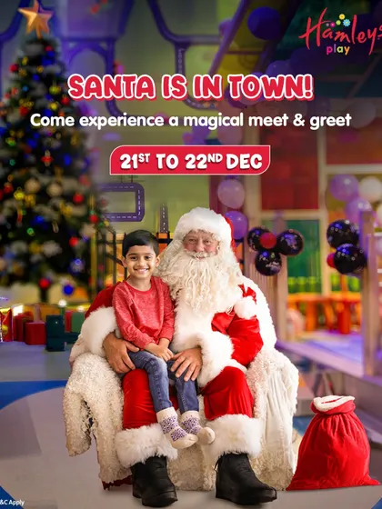 Santa is in town! This photo captures a heartwarming moment during our magical meet and greet, where a young guest gets to sit with Santa and share his Christmas wishes.