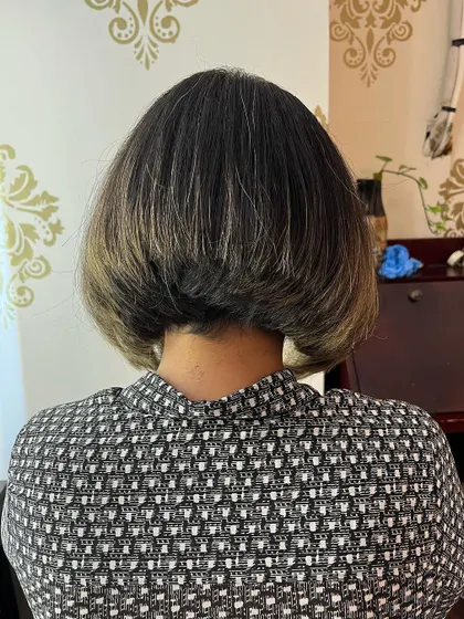 The back view shows the stacked layers of the inverted bob.