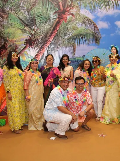 Guests having a great time at the Hawaiian-themed party. I can arrange for themed props like floral leis and fun sunglasses to help everyone get into the spirit.