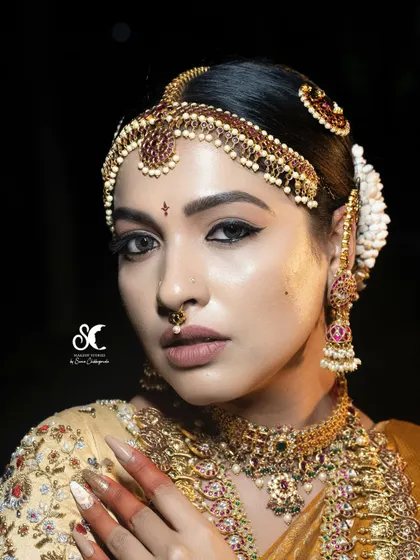 A close-up of a royal bridal look, focusing on the dramatic winged eyeliner and perfectly blended eyeshadow. Mastering eye makeup is crucial, and I dedicate significant hands-on time in my course to perfecting these detailed techniques for a captivating result.