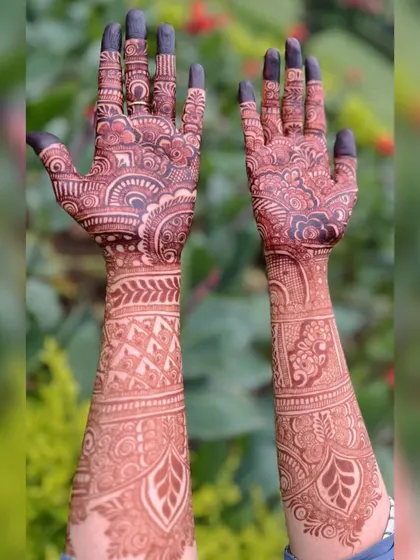 The beauty of a mature henna stain against a natural green background. The reddish-brown color is rich and vibrant, just as it should be.