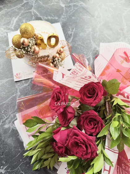 Another view of the red rose and cake combo, this one for a 40th birthday celebration.