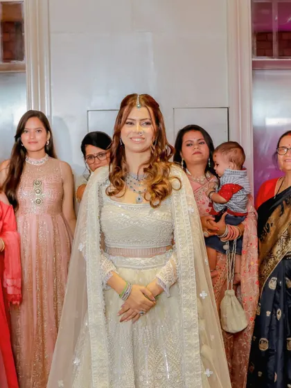 The bride-to-be surrounded by her family, a heartwarming moment of love and support.