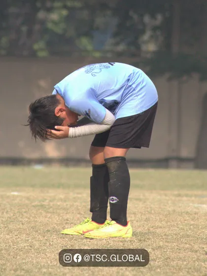 The agony of a near miss. This powerful image captures the raw emotion of a player after a close call, showing just how much the game means to these young athletes.