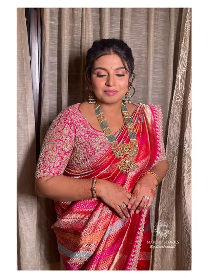 Varsha looking serene and beautiful. The makeup features soft, blended eyeshadow and a natural lip color, creating a look of effortless elegance.
