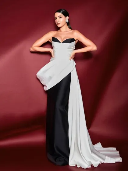 I styled Nora Fatehi in this elegant black and white sculpted gown by Mark Bumgarner. The look is a study in contrasts, combining a classic color palette with a modern, architectural silhouette for a sophisticated awards night appearance.