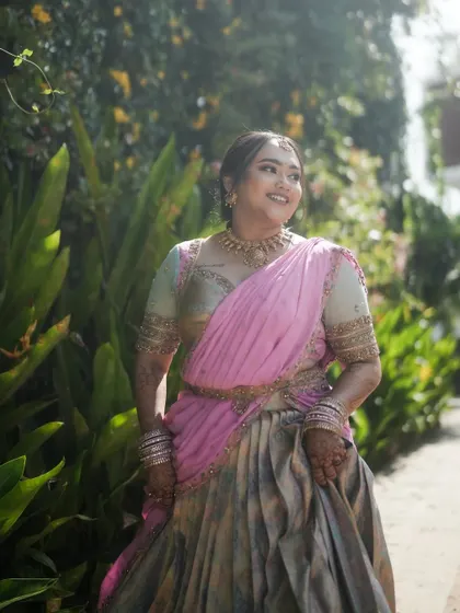 A beautiful client in a pink and grey langa voni, looking absolutely radiant for her event.