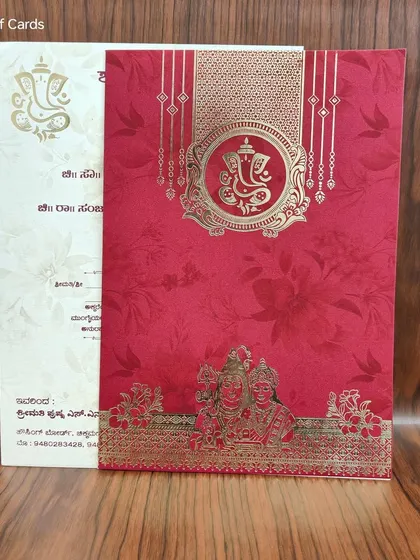 A vibrant red and gold invitation with Ganesha and Balaji motifs, offered at a budget-friendly price for a beautiful, traditional wedding.