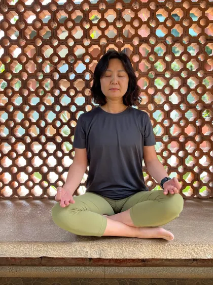 Cultivating Sakshi Bhava, the state of the detached witness, is a practice. In meditation, we learn to observe the breath and thoughts without attachment, connecting to our true consciousness.