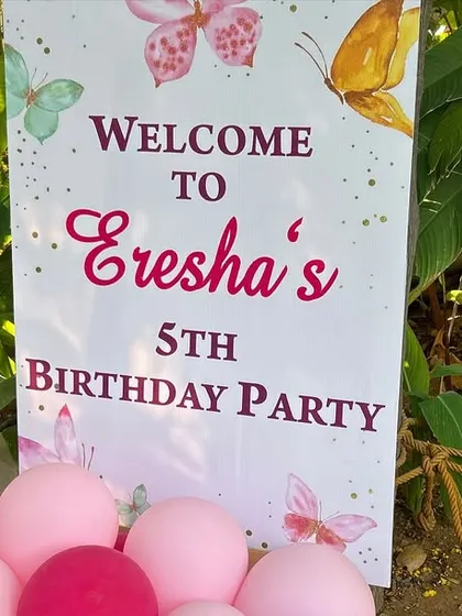 The welcome sign for the outdoor butterfly party, featuring delicate butterfly illustrations.
