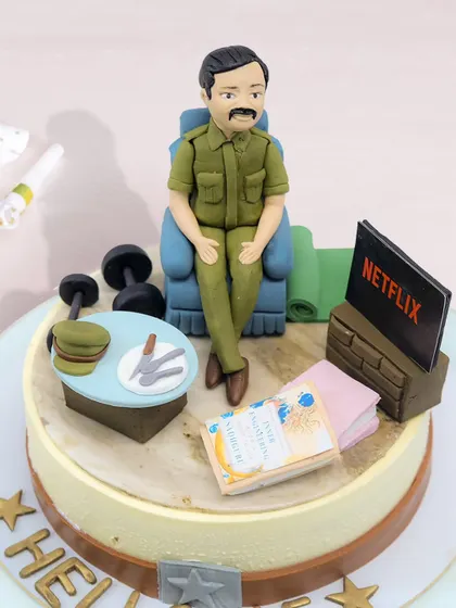 A detailed view of the "Slice of Life" cake, showing the incredible fondant details like the tiny stack of money and the Netflix logo on the TV.