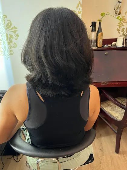 Golf Pro Rhea traded in 14 inches of long hair for this shorter, easier-to-manage style for the course.