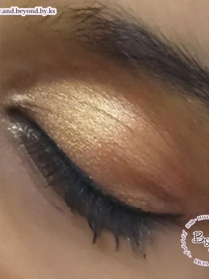 A soft golden smokey eye. This look uses warm gold tones to create a subtle yet glamorous effect that brightens the eyes. It's a perfect choice for bridesmaids or sangeet events.