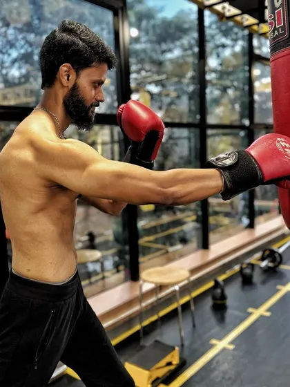 This client, now leaner and stronger, incorporates boxing into his routine, showing his improved athletic ability.