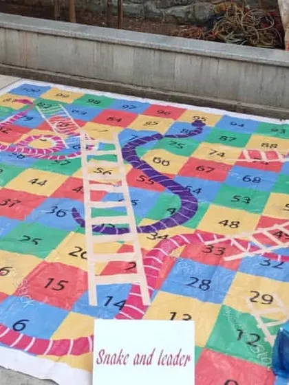 I offer a giant snakes and ladders mat that turns the board game into a life-sized interactive experience. Players can walk on the board and act as their own game pieces.