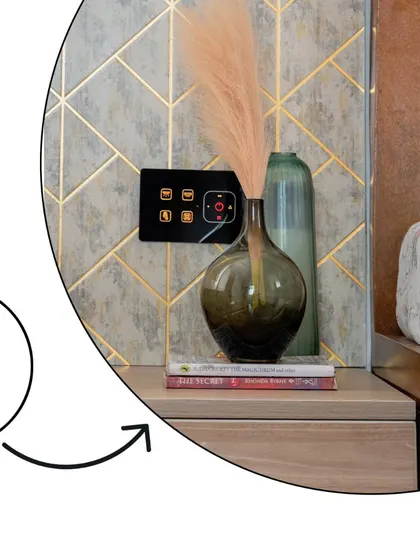 A close-up highlighting the bedside smart panel, which controls all the lighting and scenes in the master bedroom.