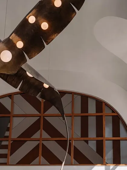 A favorite shot of the ceiling, showing the intricate curves and the beautiful way the sculptural lights interact with the architecture.