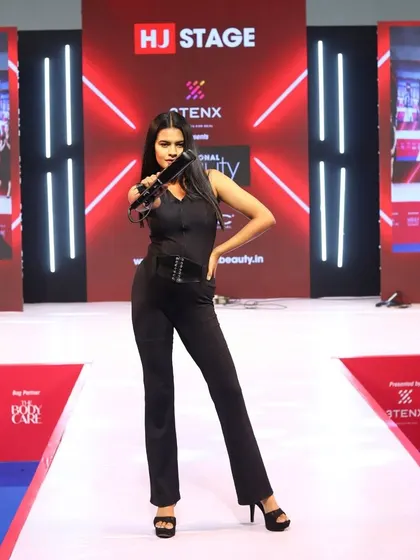 A model showcasing a finished look on the Artisto stage. These shows are all about pushing creative boundaries and inspiring other stylists.