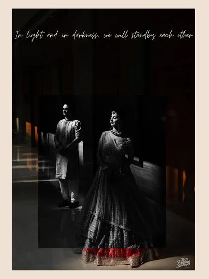 A black and white artistic portrait with the caption "In light and in darkness, we will stand by each other." The dramatic shadows create a powerful and emotional image.