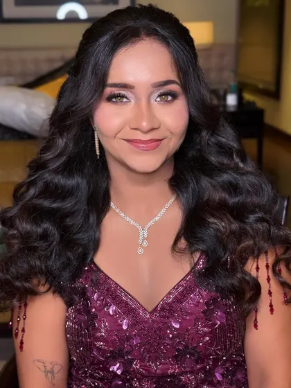 Another shot of this gorgeous reception look. The soft waves and glowing skin create a romantic and effortless vibe.