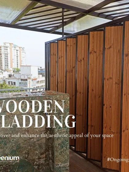 Wooden cladding is a great way to enhance the aesthetic appeal of your terrace. Here, it's used to create a warm, natural-looking partition next to a marble bar counter on an ongoing project site in Gurgaon.