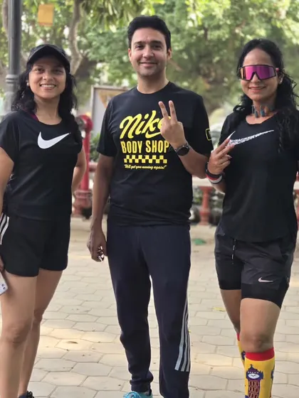 Two of our women runners with a male tribe member, all wearing Nike. We are a diverse community united by our passion for running.