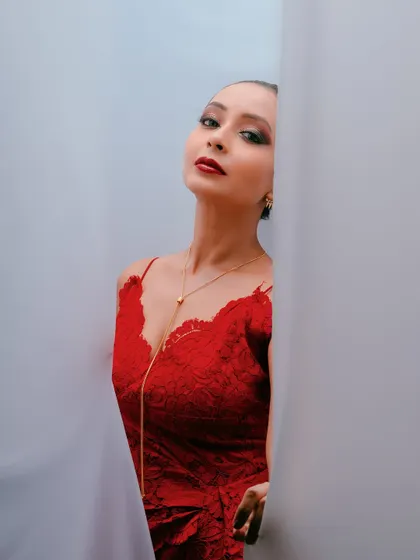 A different angle from the same shoot, with the model looking directly at the camera, creating a powerful and alluring portrait.