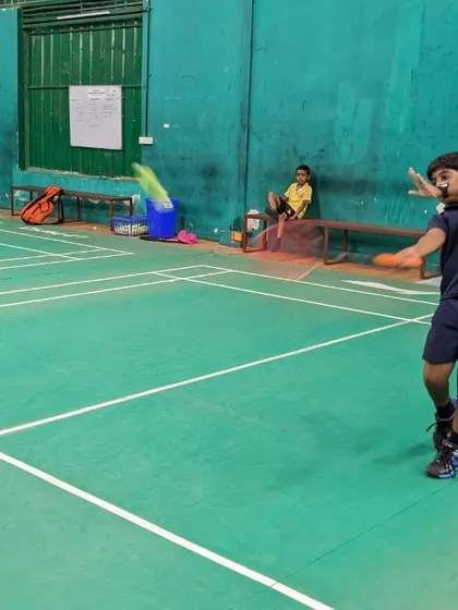 A junior player practices his forehand stroke. Our coaching breaks down each shot to ensure a strong technical foundation.