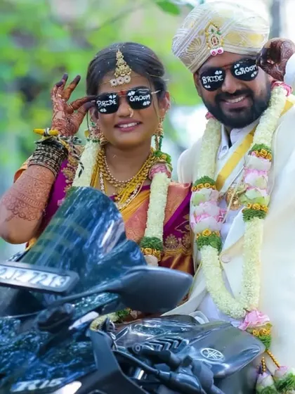 A modern and fun wedding portrait with the couple on a motorbike. This shows their personality and adds a cool, contemporary twist to their wedding album.
