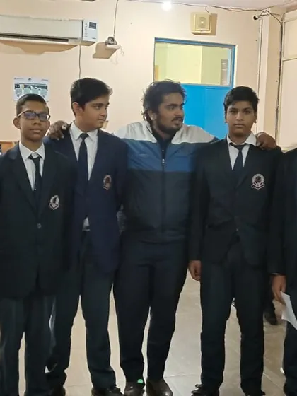 A group of students from Lions Public School pose with their instructor after an engaging workshop on emerging technologies.