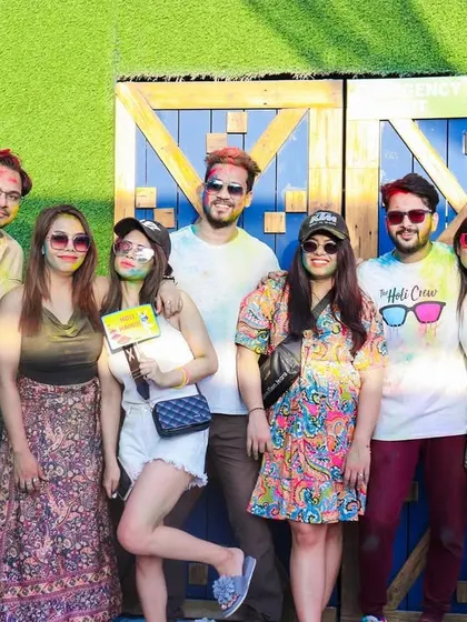 A group photo against the festive backdrop at Skygarden. These are the memories that make themed parties special.