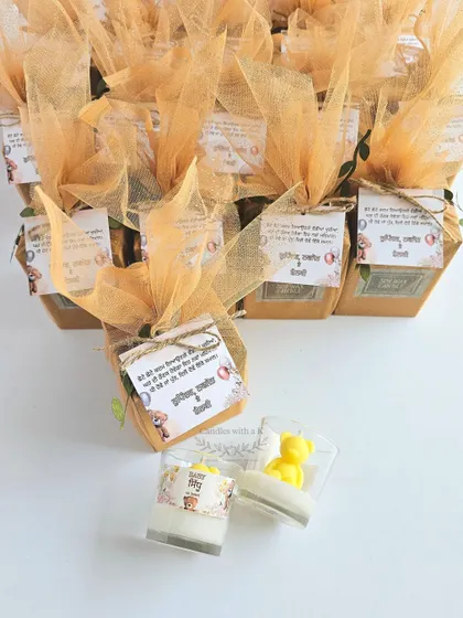 The complete, beautifully packaged teddy bear candle gift boxes, with custom tags in Punjabi, ready to be sent to a baby shower in Mohali.