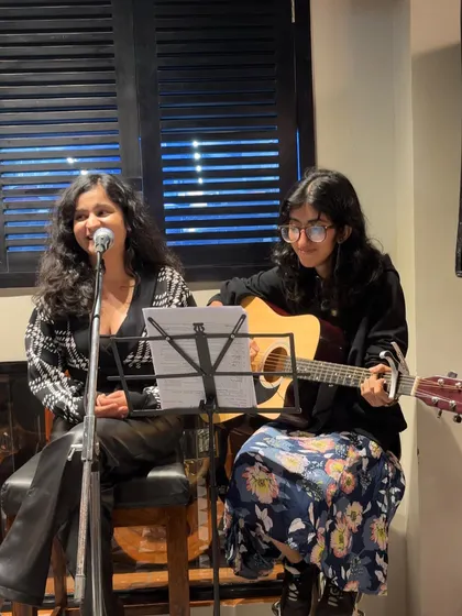 A shot of our acoustic duo setup at the Indian Origin restaurant. We provide our own sound equipment, including mics and stands, to ensure a professional performance.