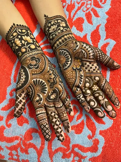 A stunning example of a full coverage bridal design for Karwachauth or a wedding. The dark, rich color is a result of my all-natural henna paste.