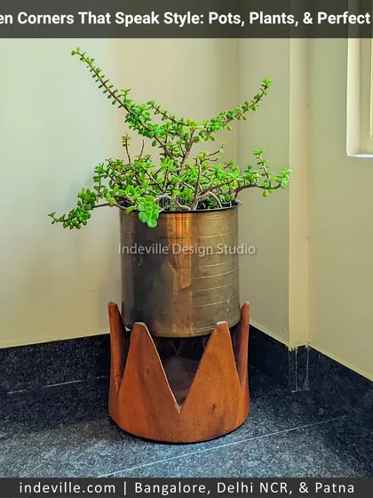 A simple green corner can speak volumes. This stylish planter, featuring a brass pot on a rustic wooden crown base, is an example of the custom decor pieces I source and create to bring a unique vibe to any indoor space.