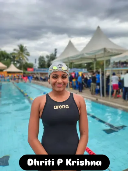 Dhriti P Krishna by the poolside, ready for her race.